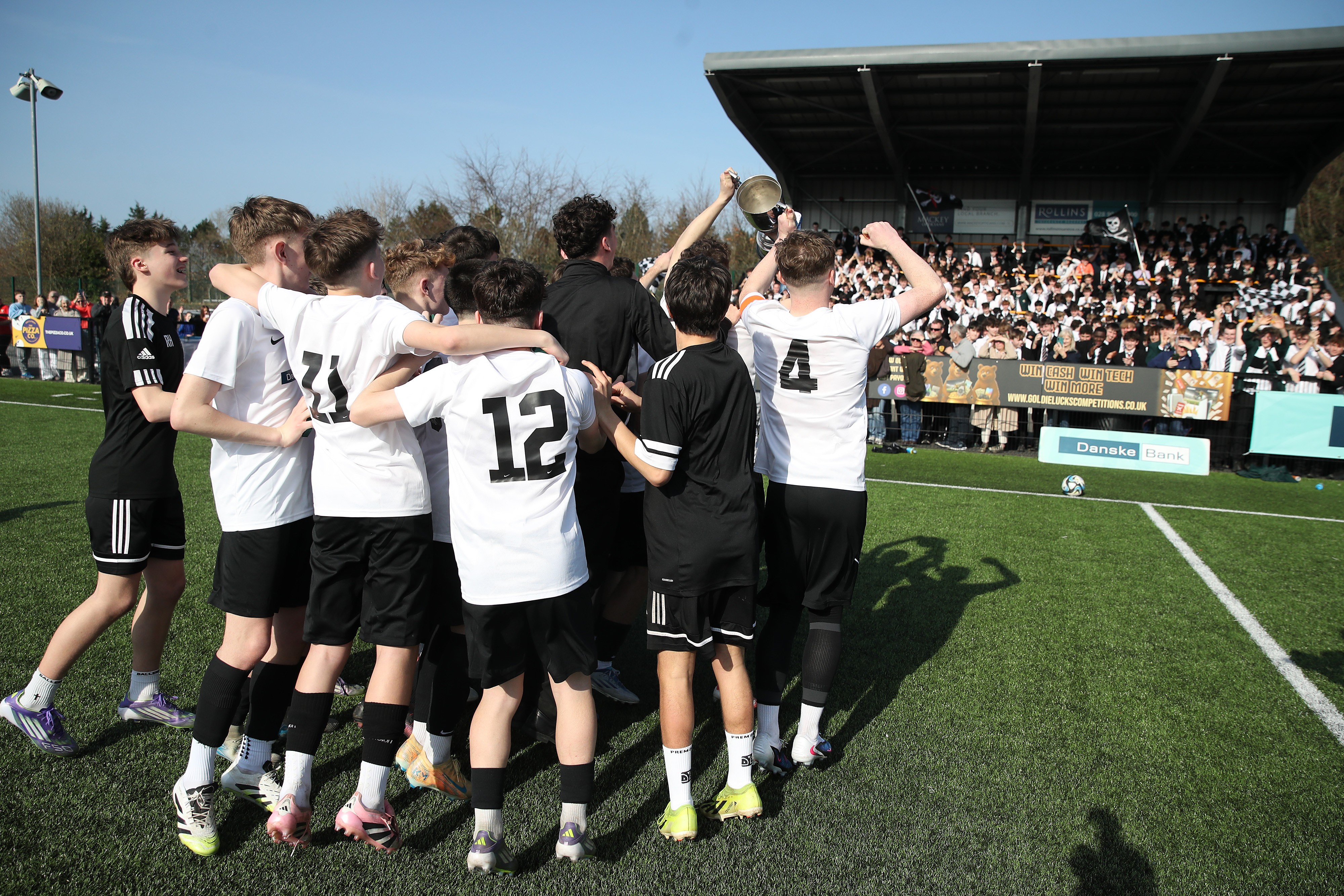Post-primary team celebrating with the trophy