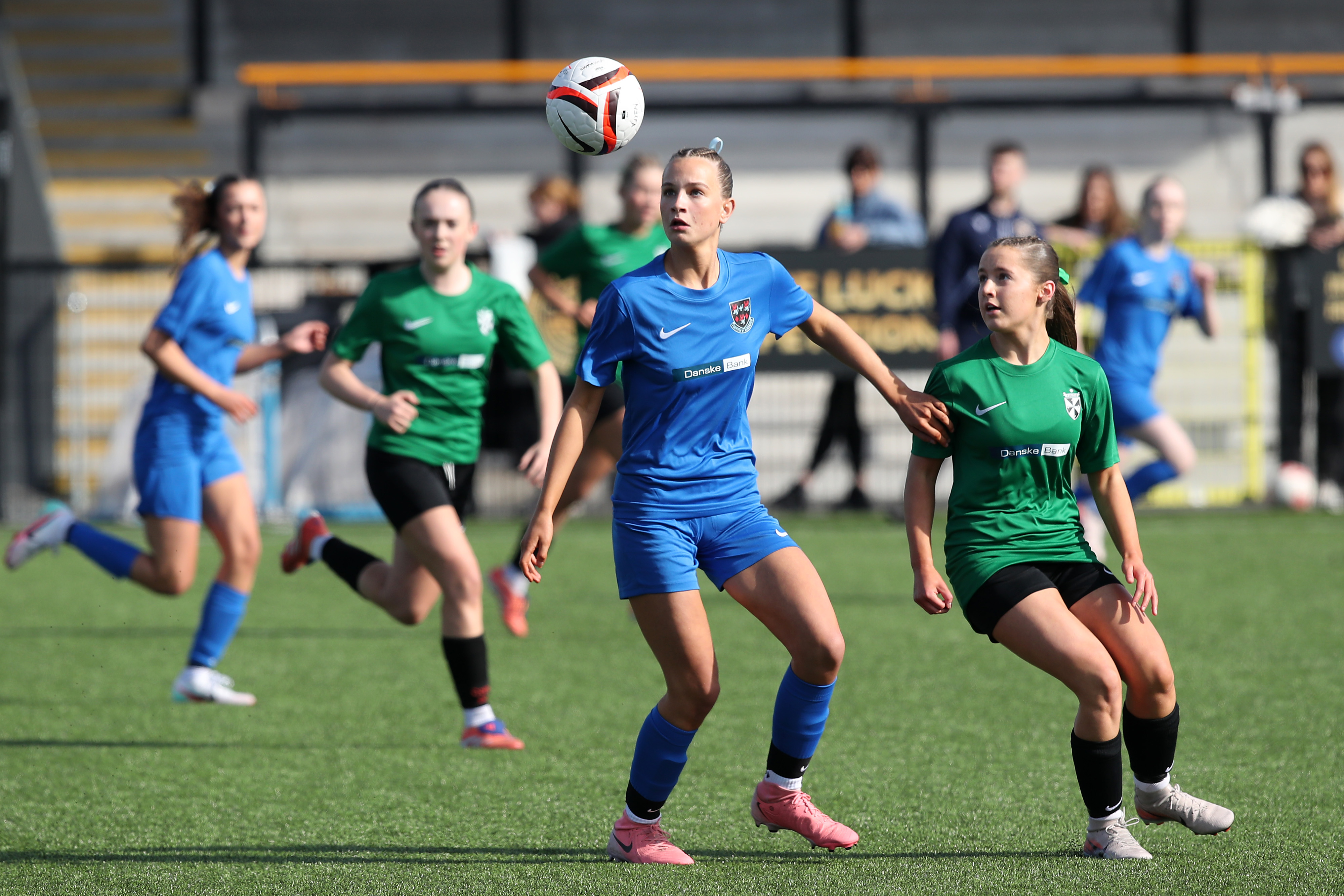 Girls competing for a high ball